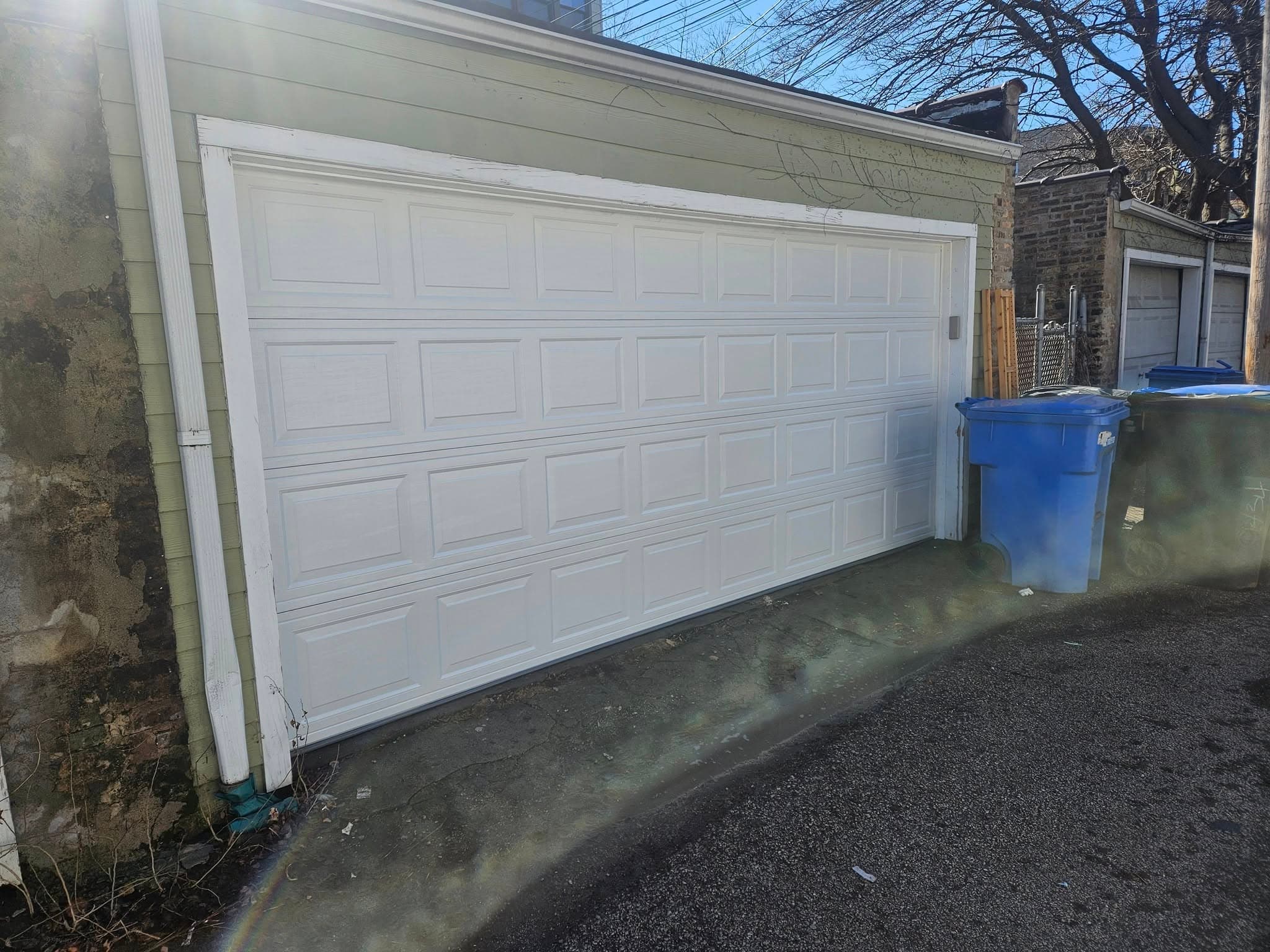 Classic raised-panel replacement. Two-car alley garage, Chicago