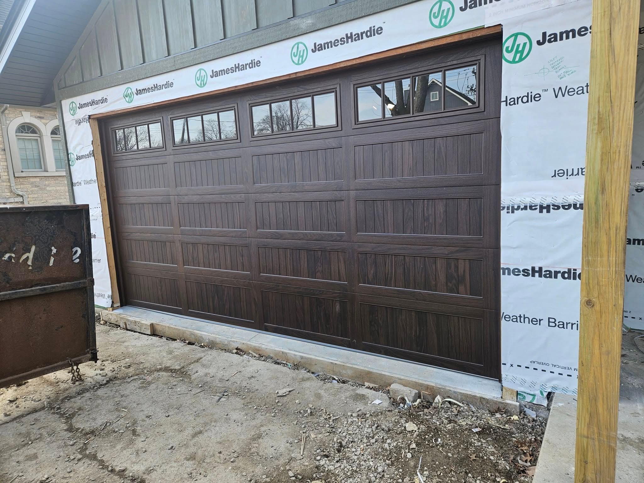 Wood-look insulated door. New construction install, west suburbs