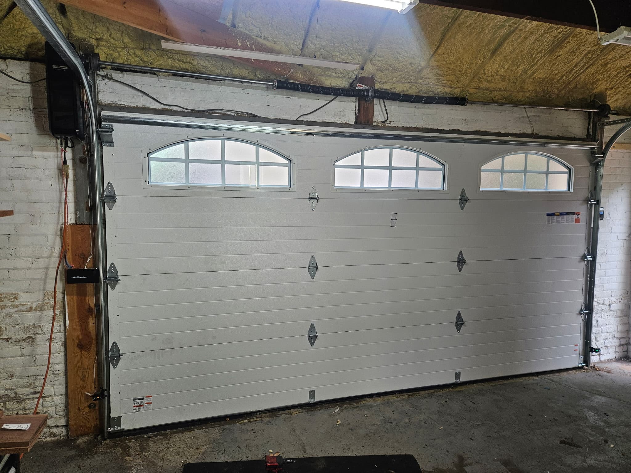 Wood-look insulated door. New construction install, west suburbs