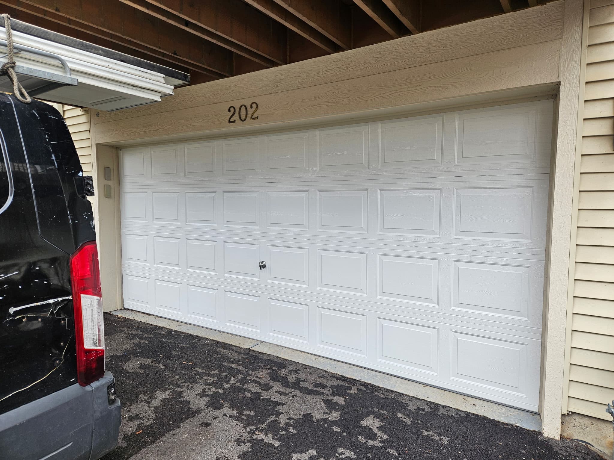 Wood-look insulated door. New construction install, west suburbs