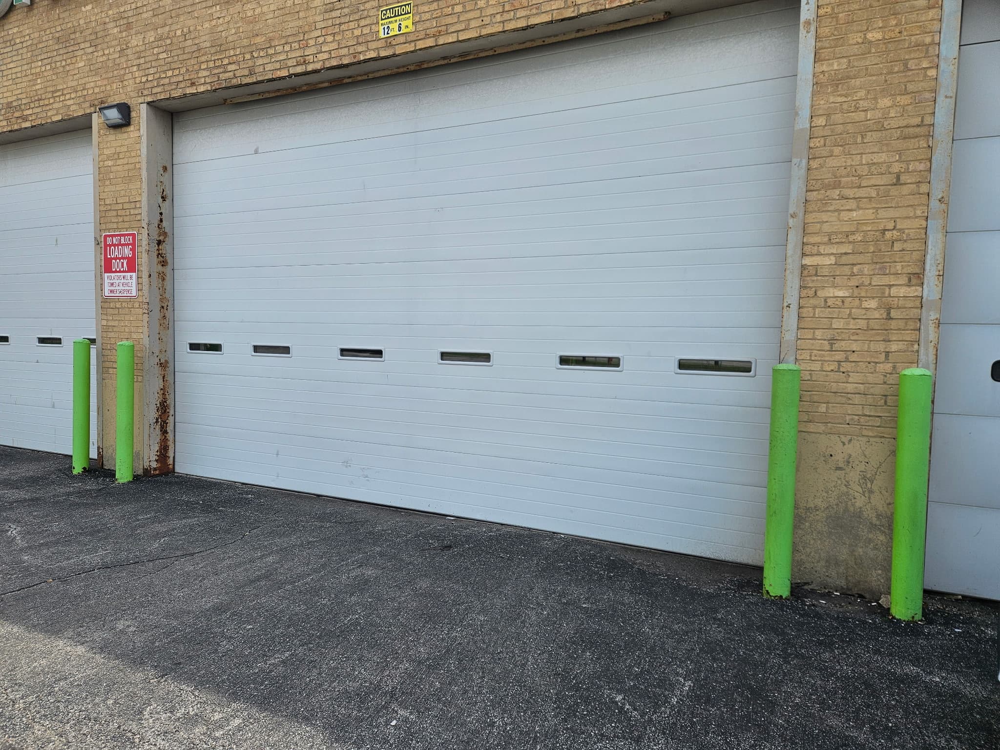 Classic raised-panel replacement. Two-car alley garage, Chicago
